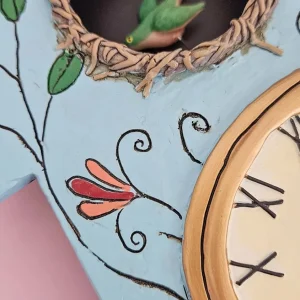 14.9 Inch | Stone Resin Decorative Clocks for Walls Home Decor Kitchen Clocks | Allen Designs Birdhouse with Flowers Cuckoo Wall Clock - Battery Operated Pendulum Analog Clock